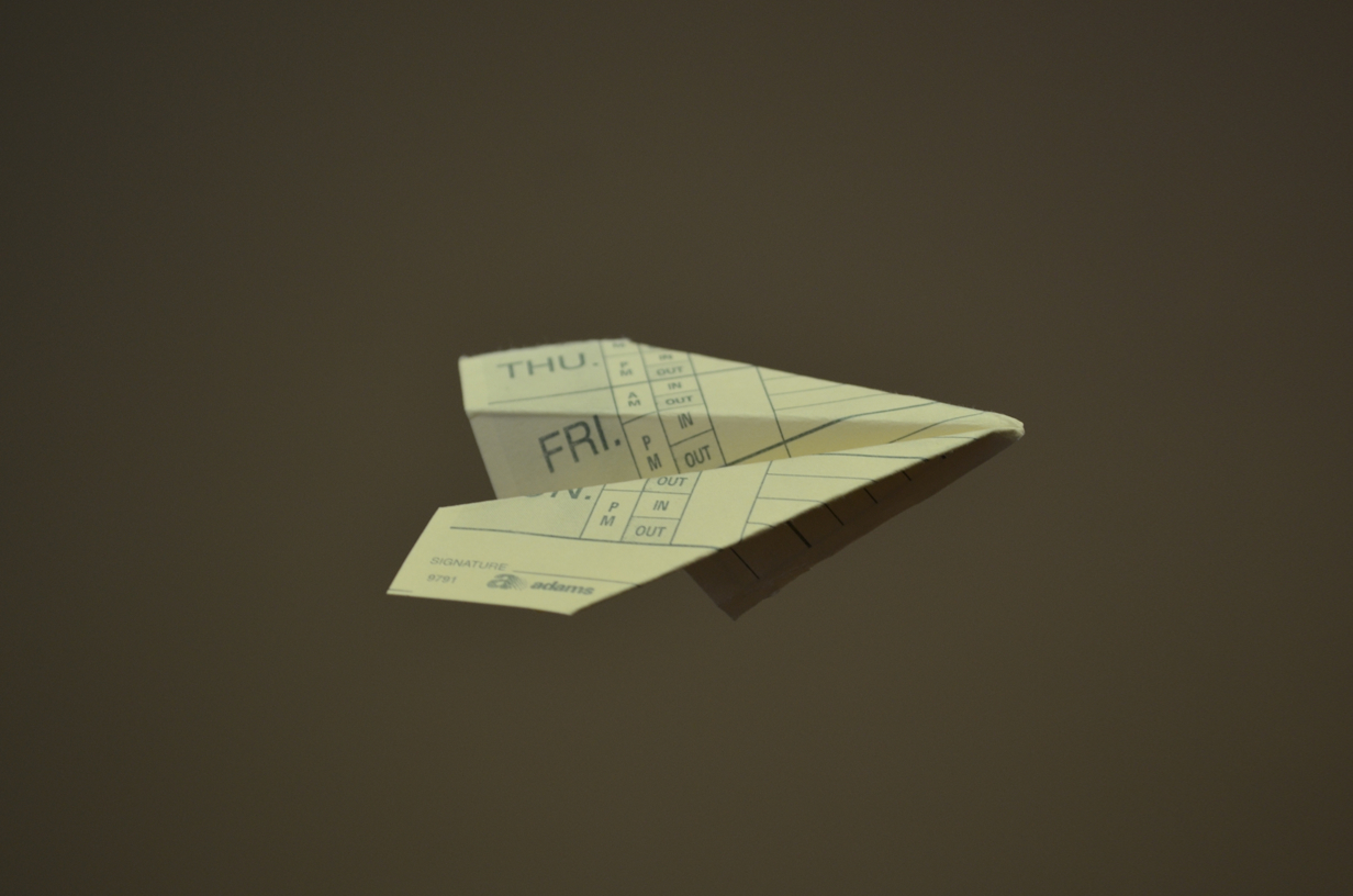 timecard paper airplane