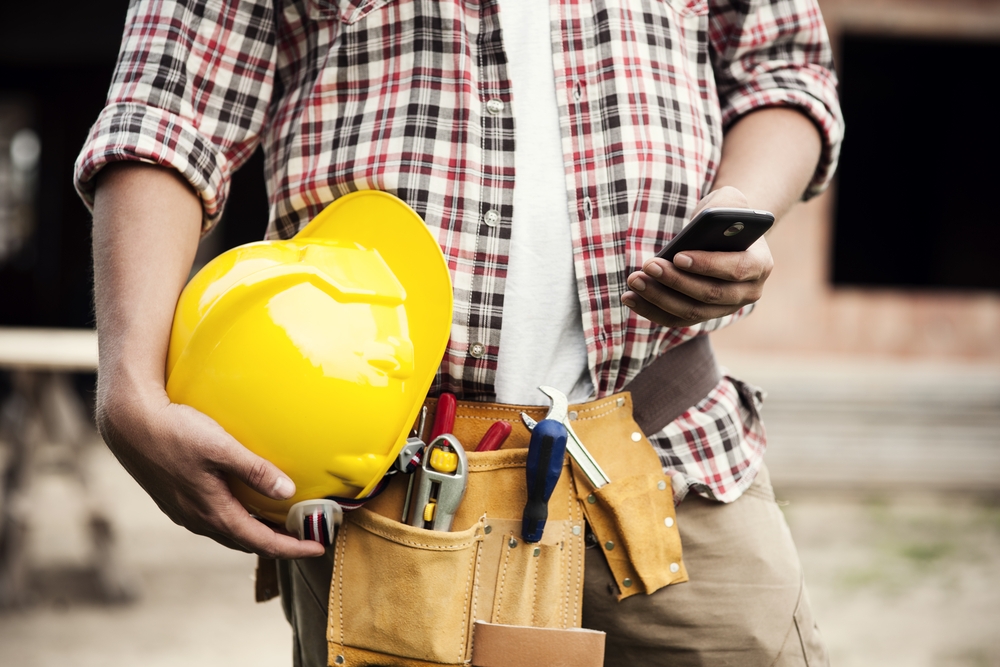 construction worker using busybusy, a mobile time tracking app