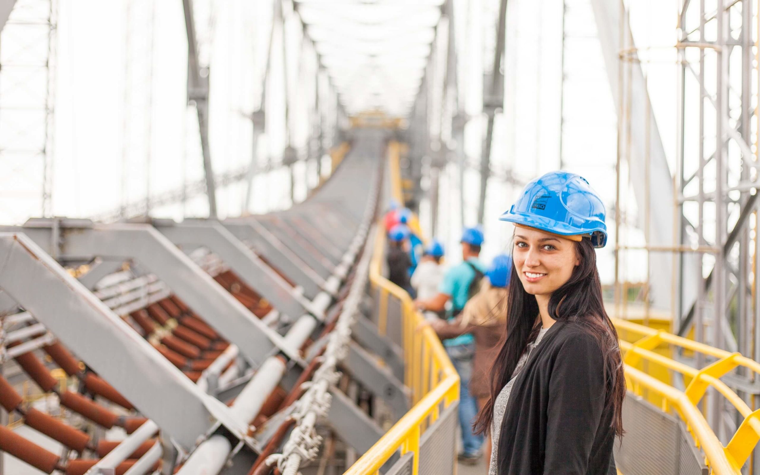 Woman Standing at Construction Site Determining Labor Burden of Employees