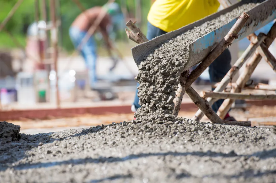 Construction workers pouring concrete