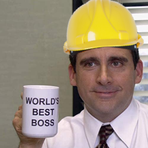 Micheal Scott holding a world’s best boss mug.