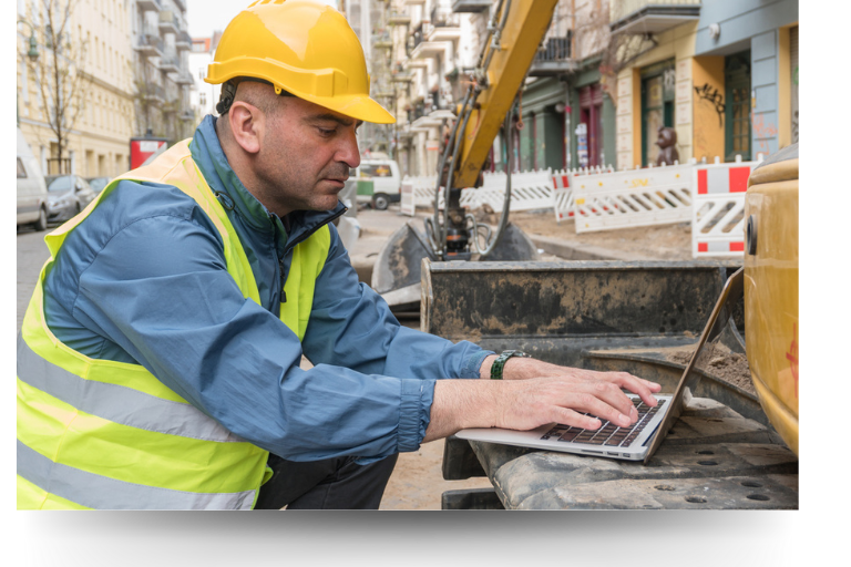 construction worker using computer