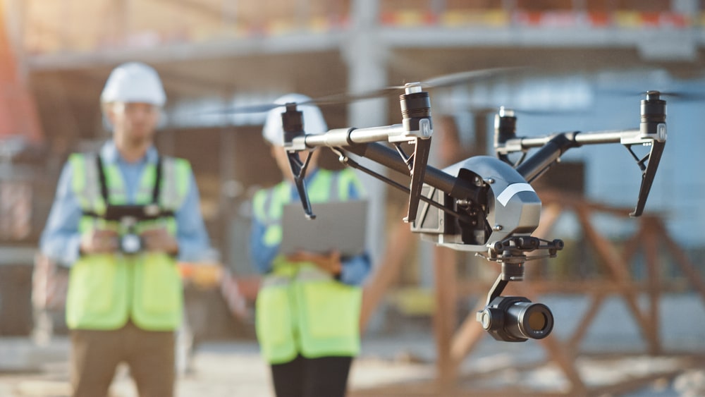 construction workers using drone